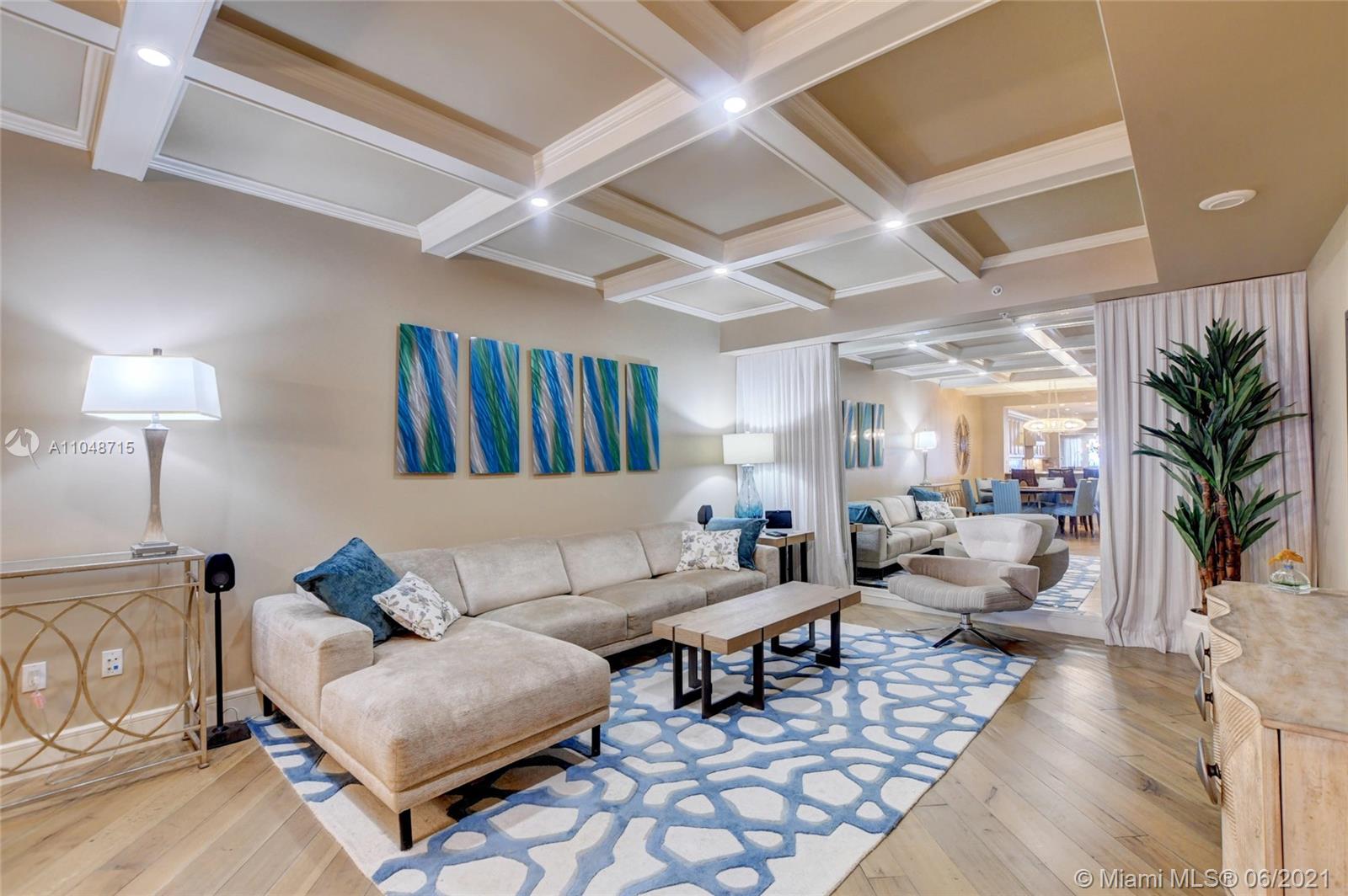 2500 South Ocean Boulevard, Unit 702 Boca Raton, FL 33432 - Photo 27 of 61 a living room with furniture and a lamp