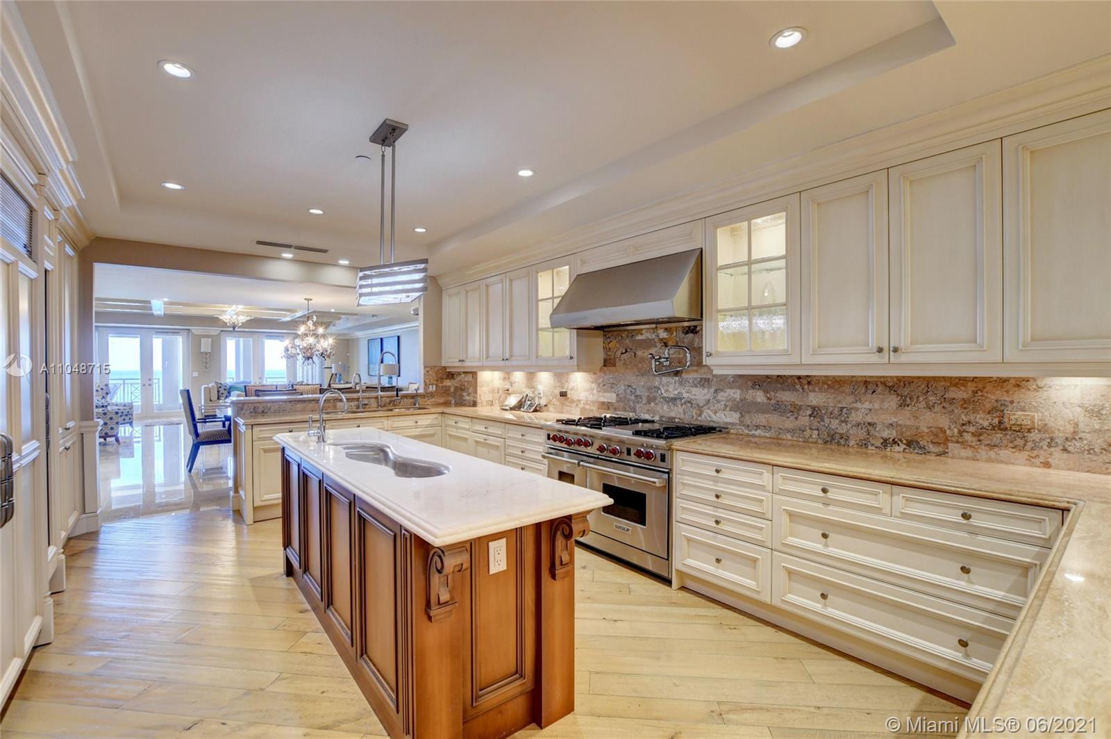 2500 South Ocean Boulevard, Unit 702 Boca Raton, FL 33432 - Photo 31 of 61 a kitchen with stainless steel appliances granite countertop a stove and a sink