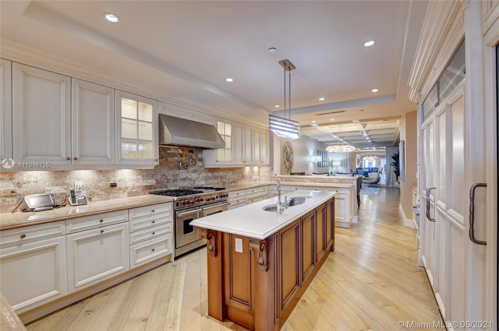 2500 South Ocean Boulevard, Unit 702 Boca Raton, FL 33432 - Photo 32 of 61 a kitchen with stainless steel appliances granite countertop a stove and a sink