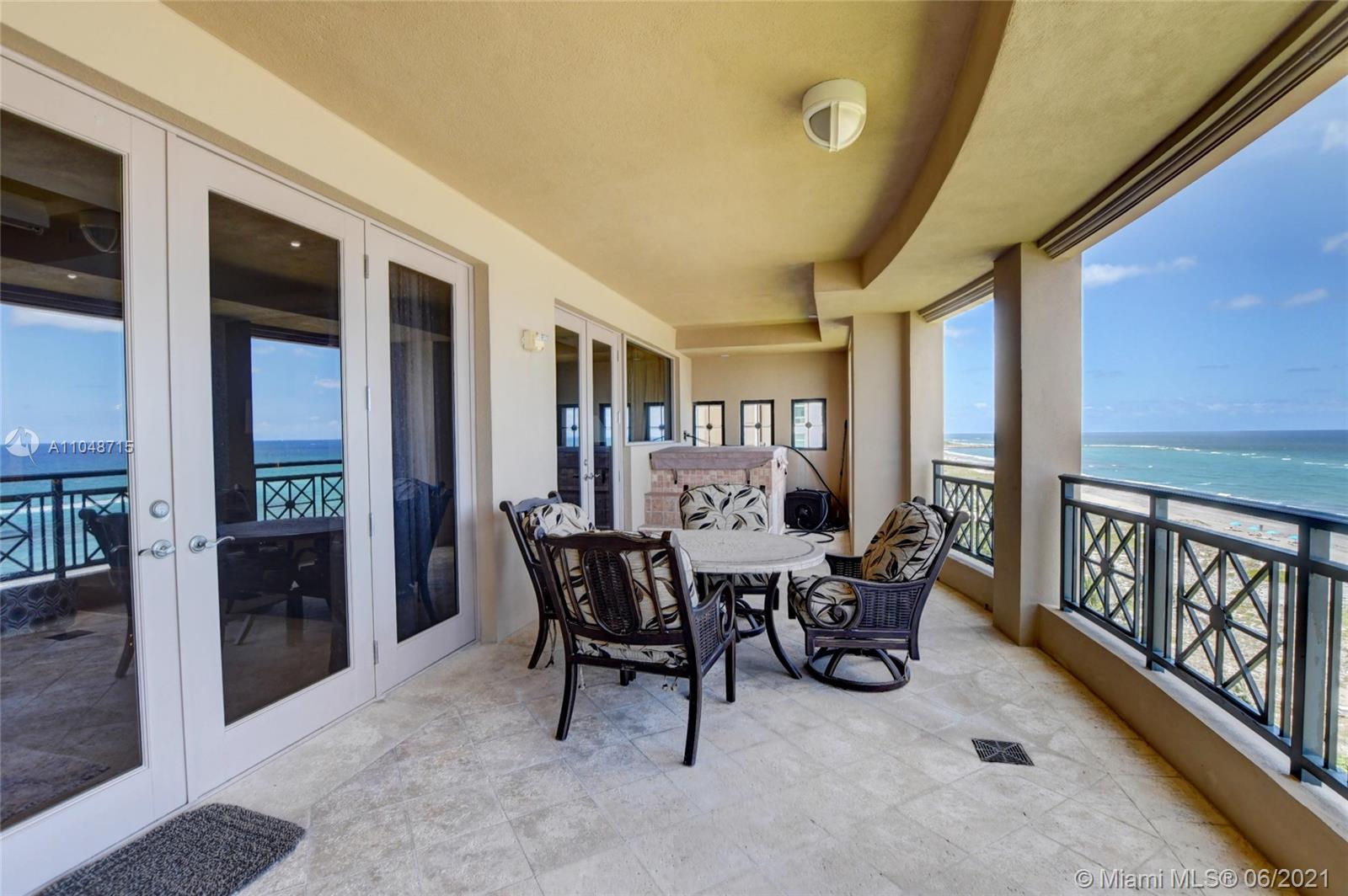 2500 South Ocean Boulevard, Unit 702 Boca Raton, FL 33432 - Photo 41 of 61 a dining room with furniture and a floor to ceiling window