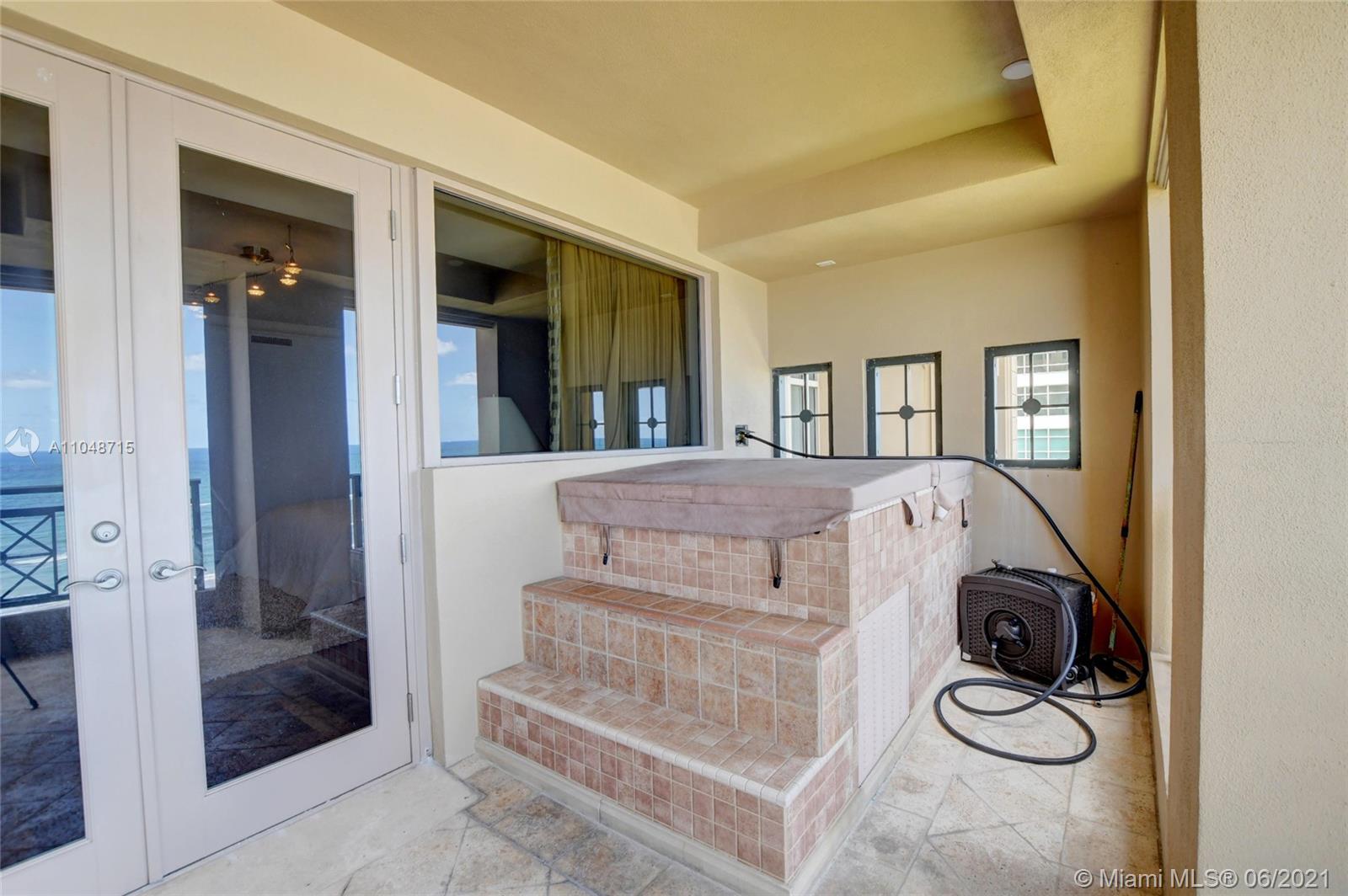 2500 South Ocean Boulevard, Unit 702 Boca Raton, FL 33432 - Photo 42 of 61 a view of a bedroom with washer and dryer