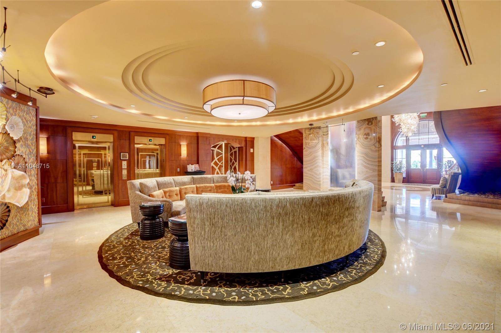 2500 South Ocean Boulevard, Unit 702 Boca Raton, FL 33432 - Photo 47 of 61 a living room with furniture a large window and wooden floor