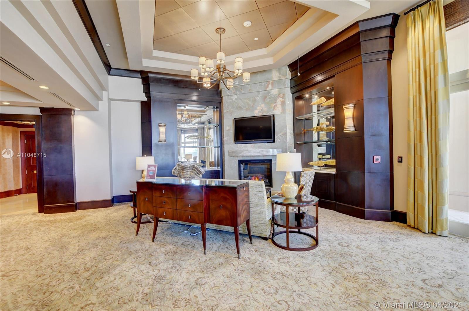 2500 South Ocean Boulevard, Unit 702 Boca Raton, FL 33432 - Photo 49 of 61 a view of a livingroom with furniture and a fireplace