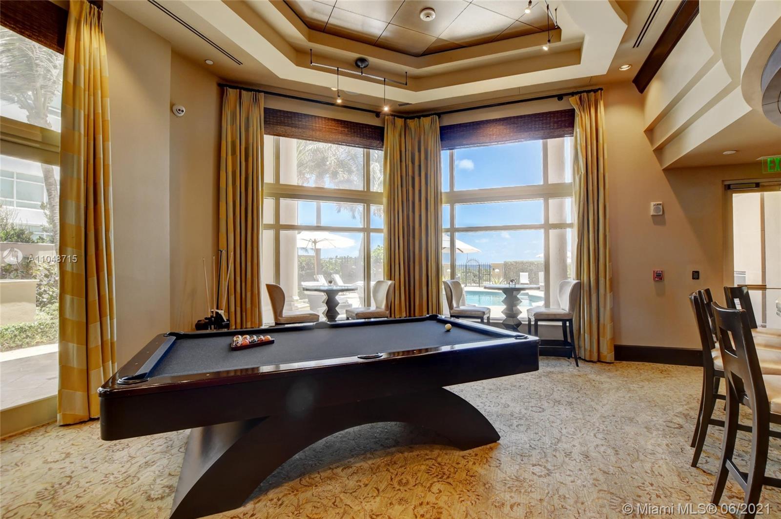 2500 South Ocean Boulevard, Unit 702 Boca Raton, FL 33432 - Photo 50 of 61 a living room with a large window and furniture