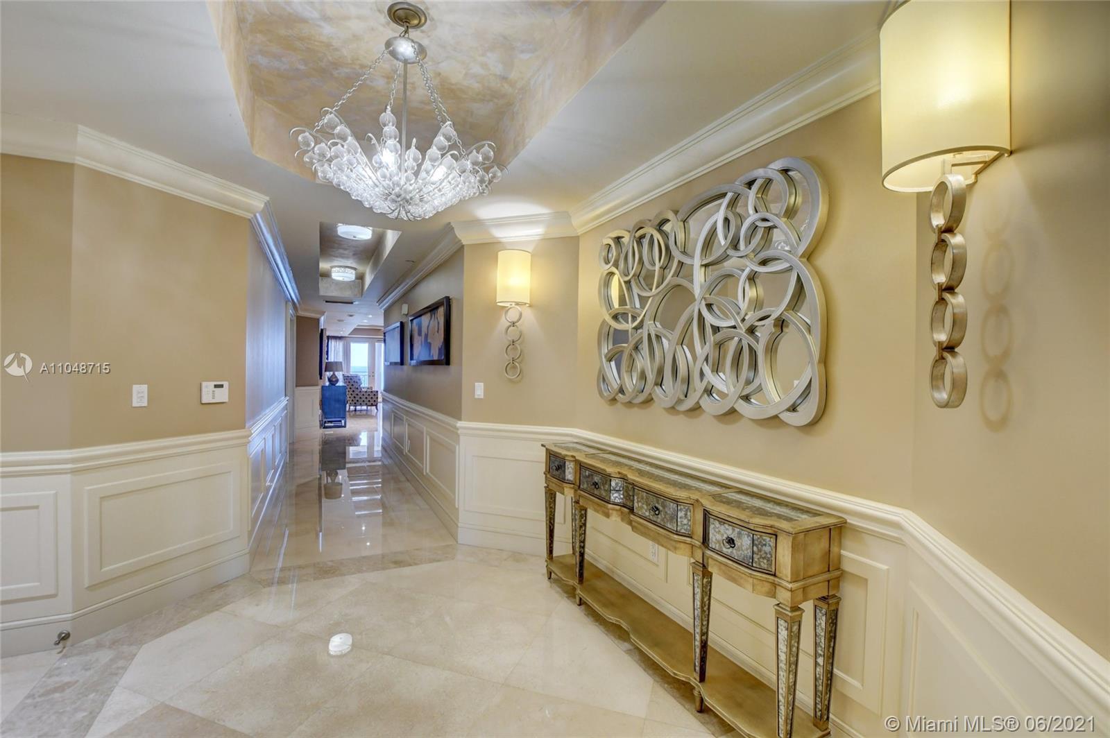 2500 South Ocean Boulevard, Unit 702 Boca Raton, FL 33432 - Photo 6 of 61 a view of a hallway with chandelier