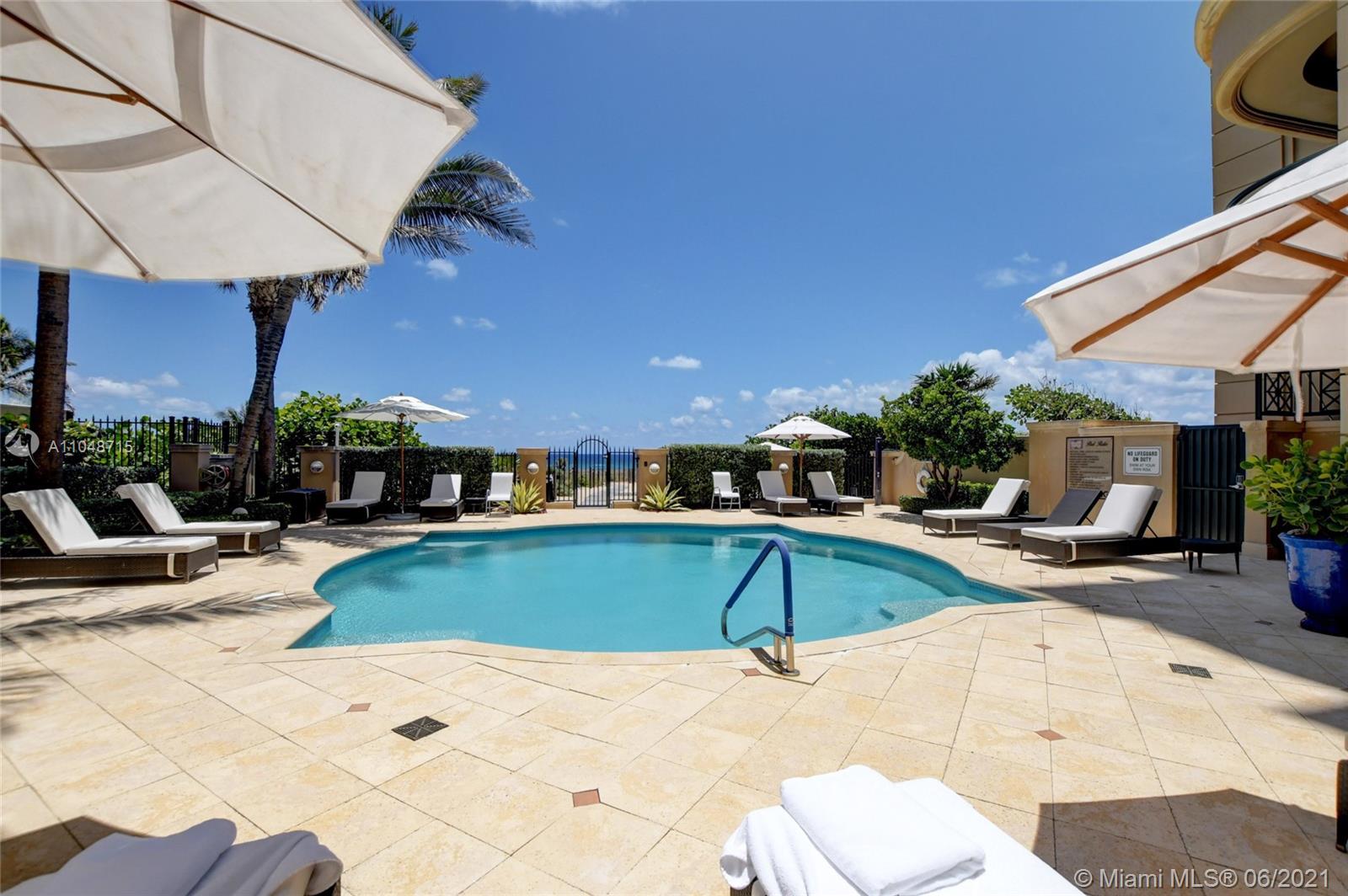 2500 South Ocean Boulevard, Unit 702 Boca Raton, FL 33432 - Photo 54 of 61 a view of a swimming pool with lounge chairs