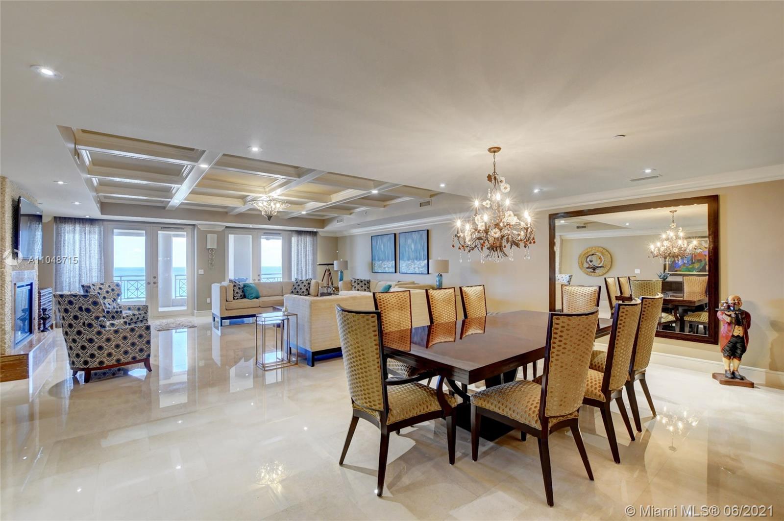 2500 South Ocean Boulevard, Unit 702 Boca Raton, FL 33432 - Photo 8 of 61 a dining room with furniture window and wooden floor