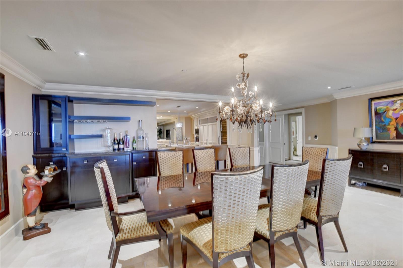 2500 South Ocean Boulevard, Unit 702 Boca Raton, FL 33432 - Photo 10 of 61 a view of a dining room with furniture and chandelier