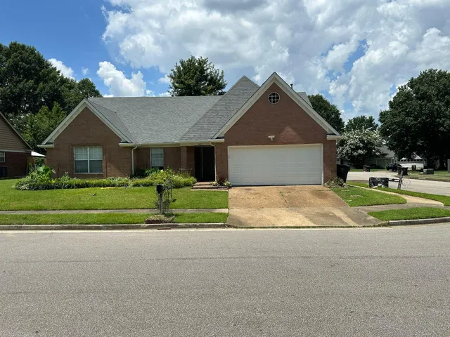 a house view with a garden space