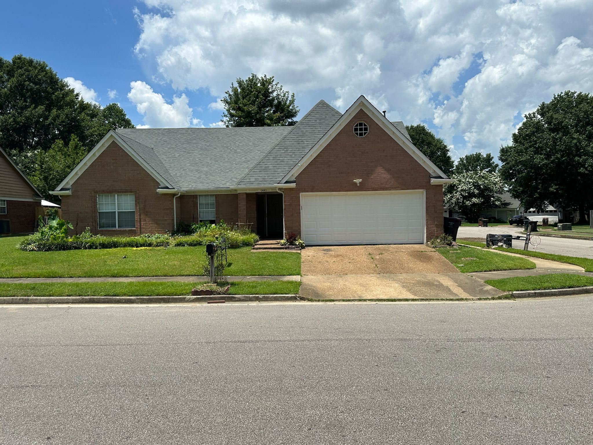 1441 Milestone Drive Collierville, TN 38017 - Photo 1 of 16 a house view with a garden space