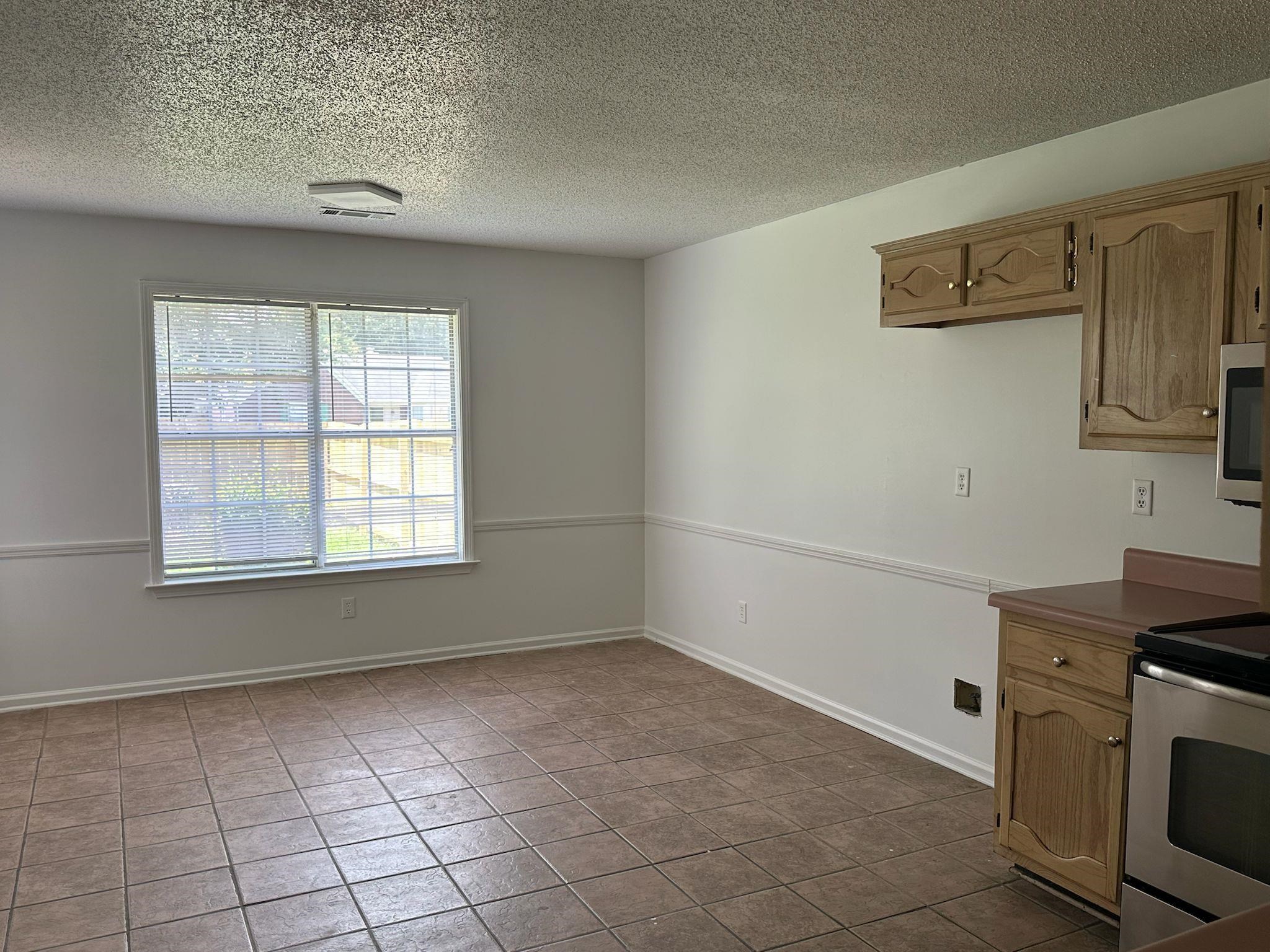 1441 Milestone Drive Collierville, TN 38017 - Photo 7 of 16 a view of kitchen and utility room