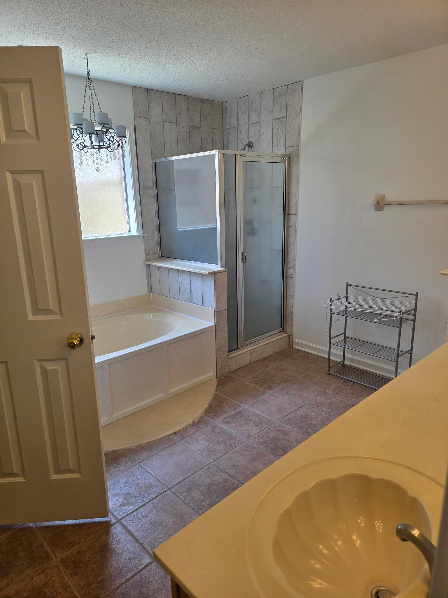 1441 Milestone Drive Collierville, TN 38017 - Photo 10 of 16 a bathroom with a tub and shower