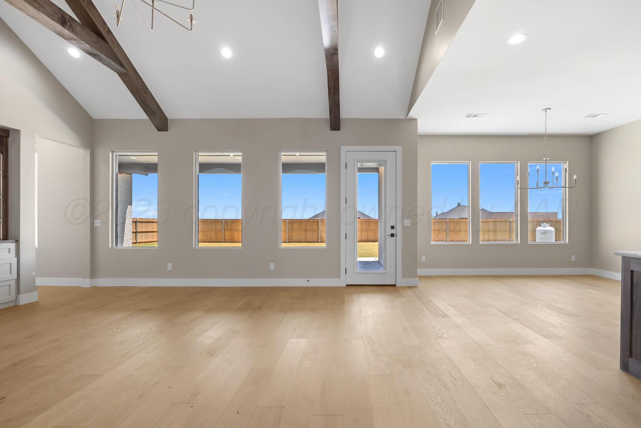 4201 Juniper Springs Road Amarillo, TX 79119 - Photo 4 of 27 an empty room with large windows