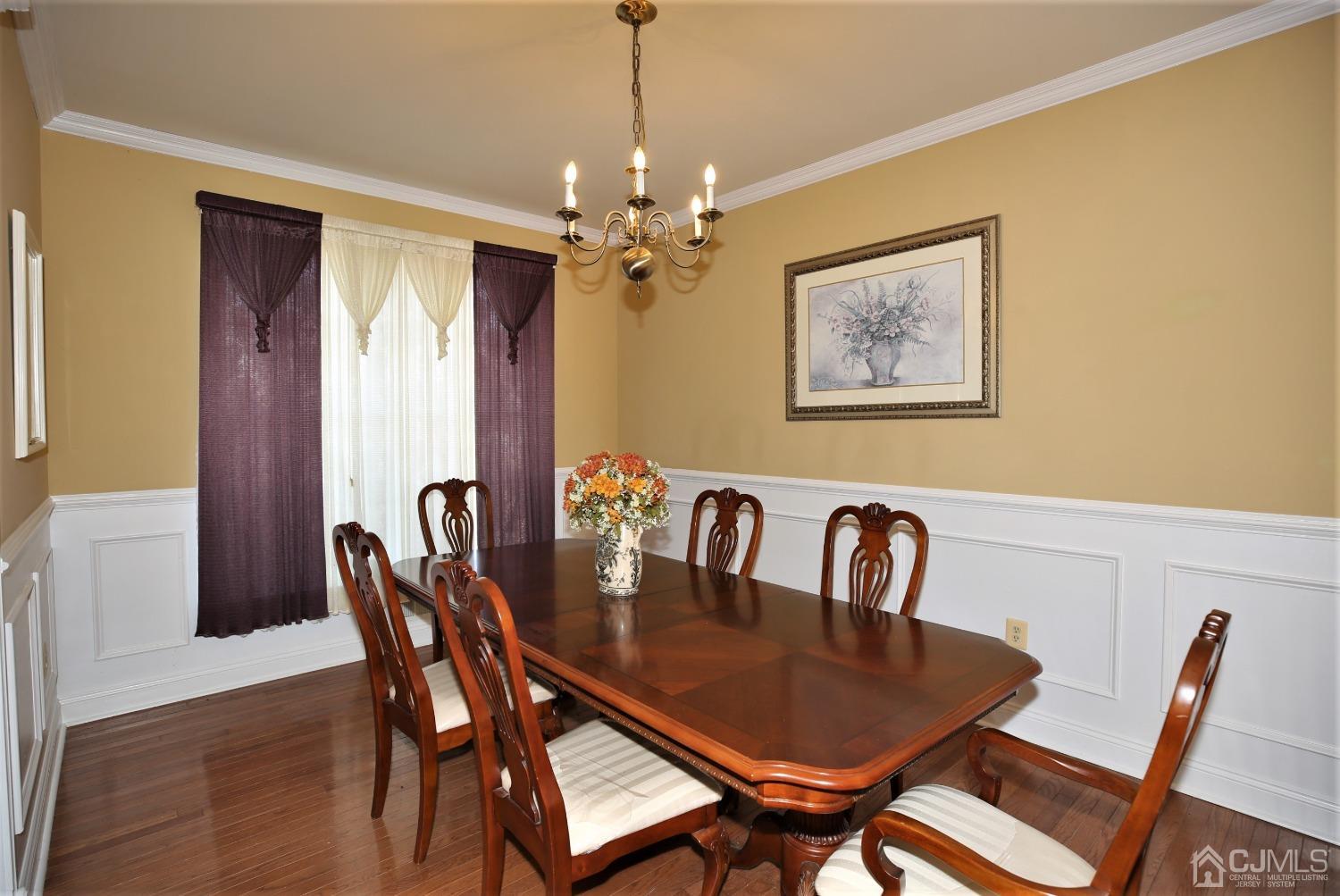 28 Lexington Road Monmouth Junction, NJ 08852 - Photo 11 of 55 a view of a dining room with furniture and chandelier