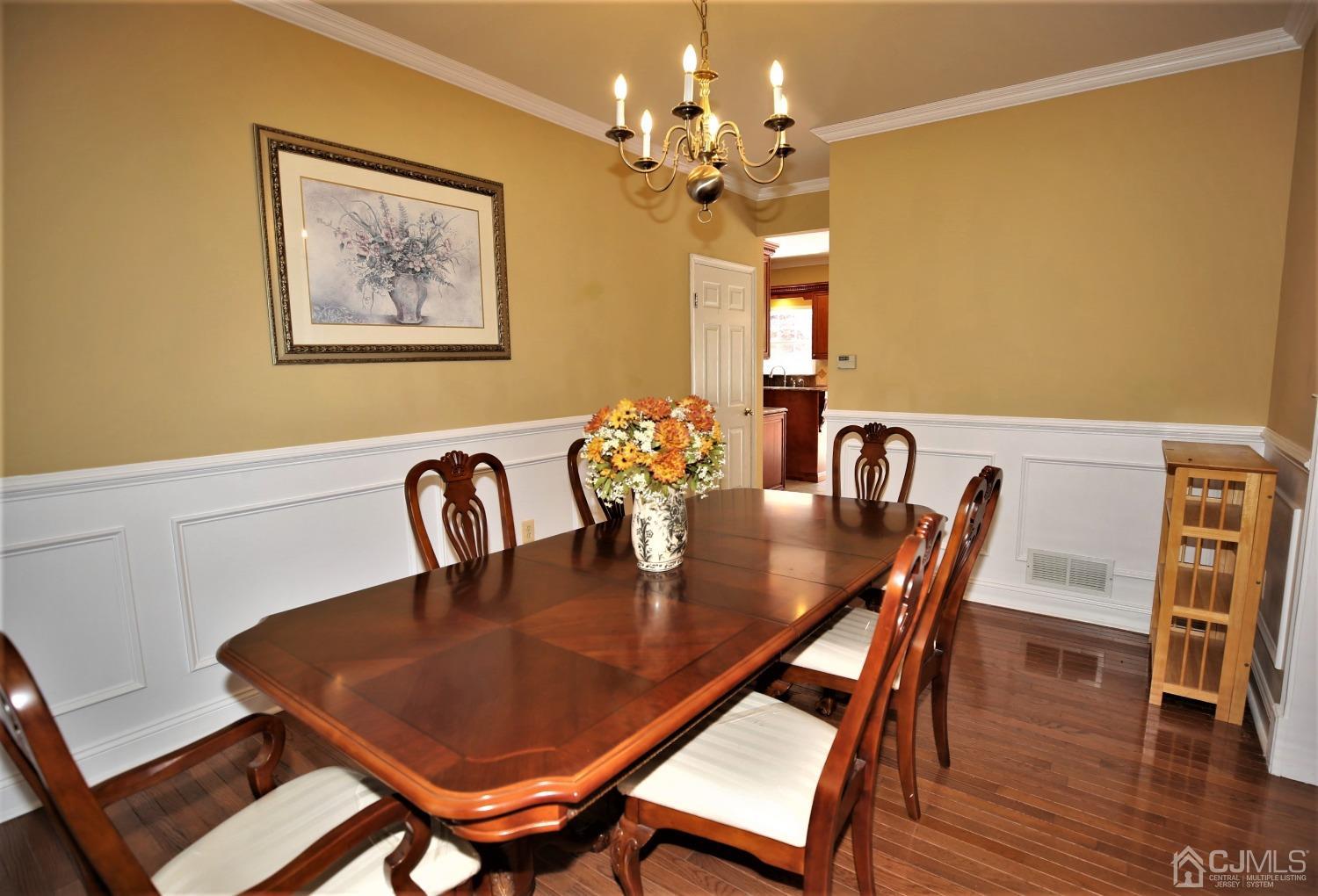 28 Lexington Road Monmouth Junction, NJ 08852 - Photo 12 of 55 a view of a dining room with furniture and wooden floor