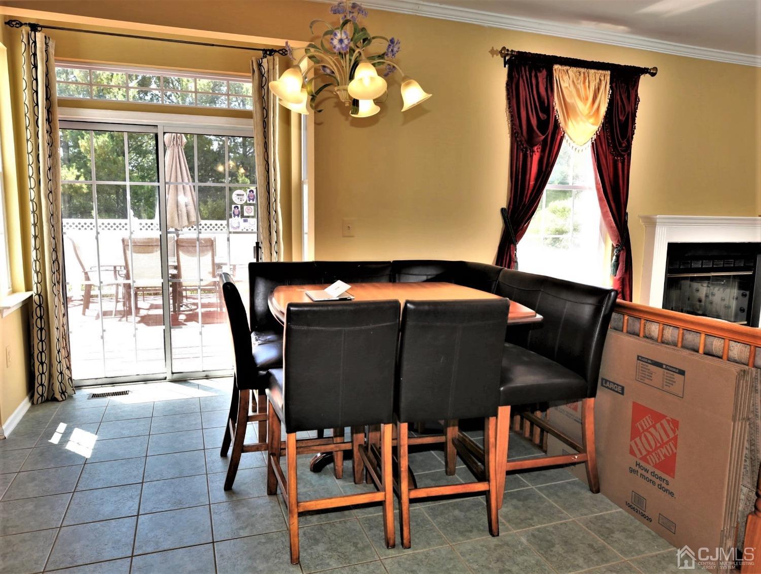 28 Lexington Road Monmouth Junction, NJ 08852 - Photo 20 of 55 a dining room table with chair and window