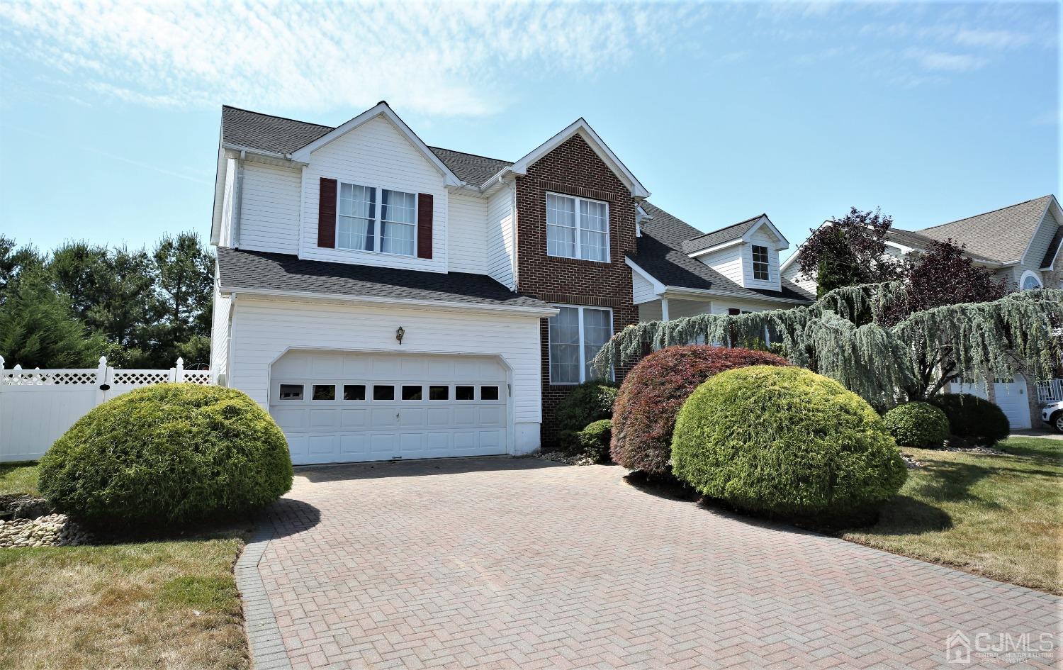 28 Lexington Road Monmouth Junction, NJ 08852 - Photo 2 of 55 a front view of a house with a yard and garage