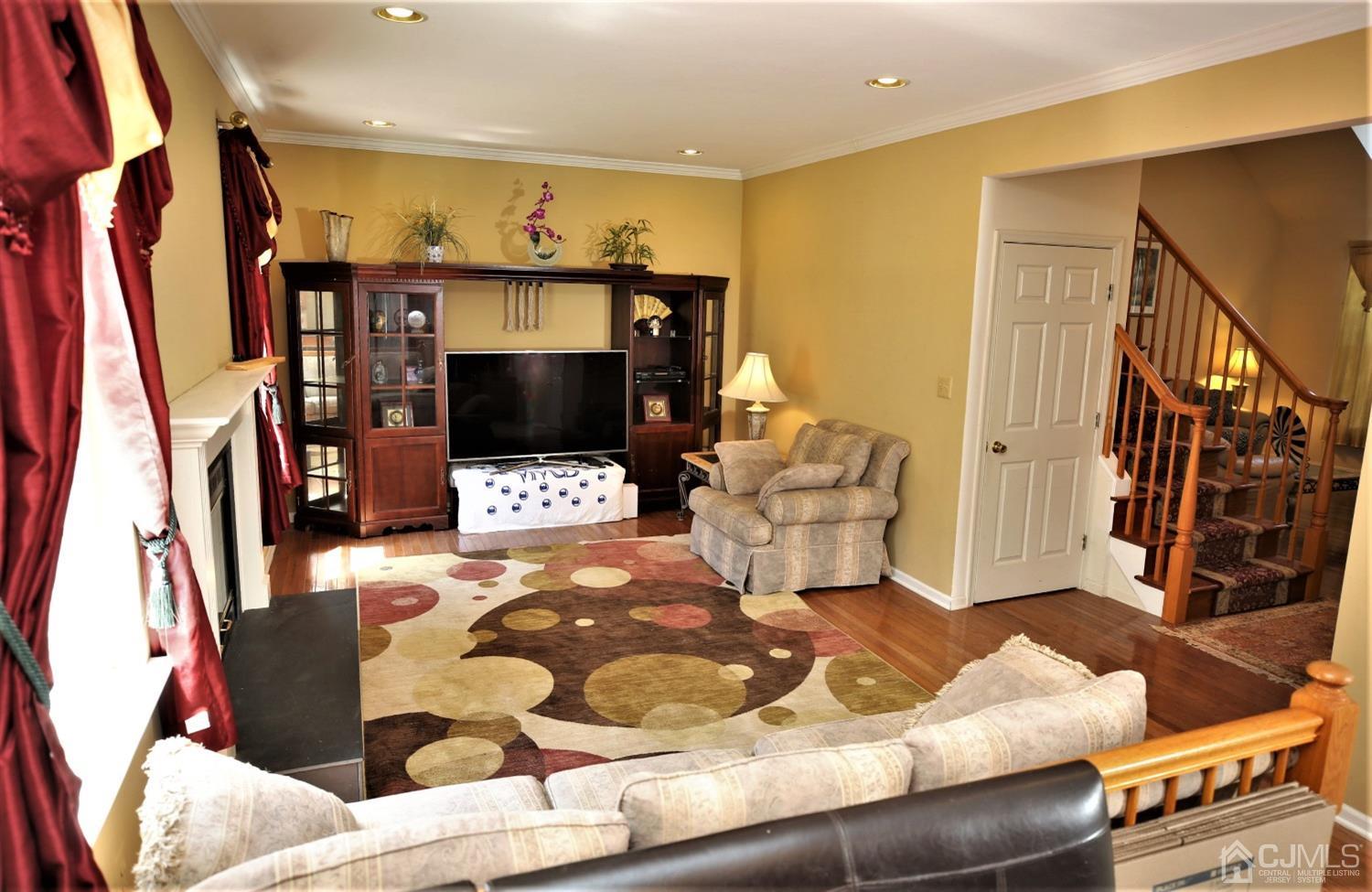 28 Lexington Road Monmouth Junction, NJ 08852 - Photo 21 of 55 a living room with furniture and a flat screen tv
