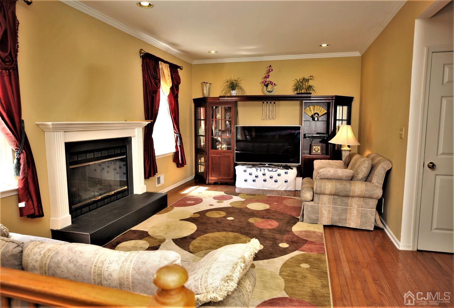 28 Lexington Road Monmouth Junction, NJ 08852 - Photo 22 of 55 a living room with furniture and a fireplace