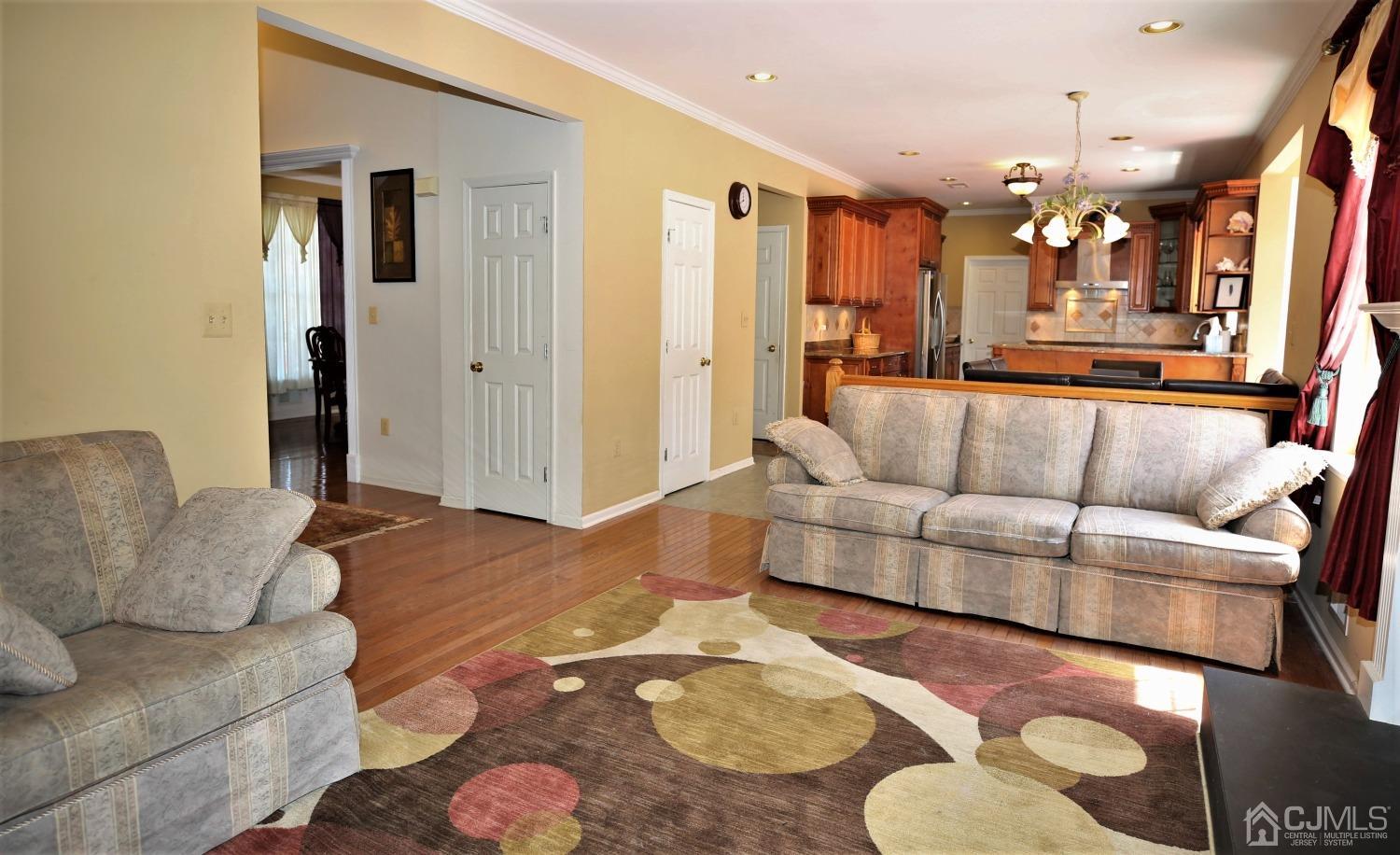 28 Lexington Road Monmouth Junction, NJ 08852 - Photo 23 of 55 a living room with furniture and a dining table
