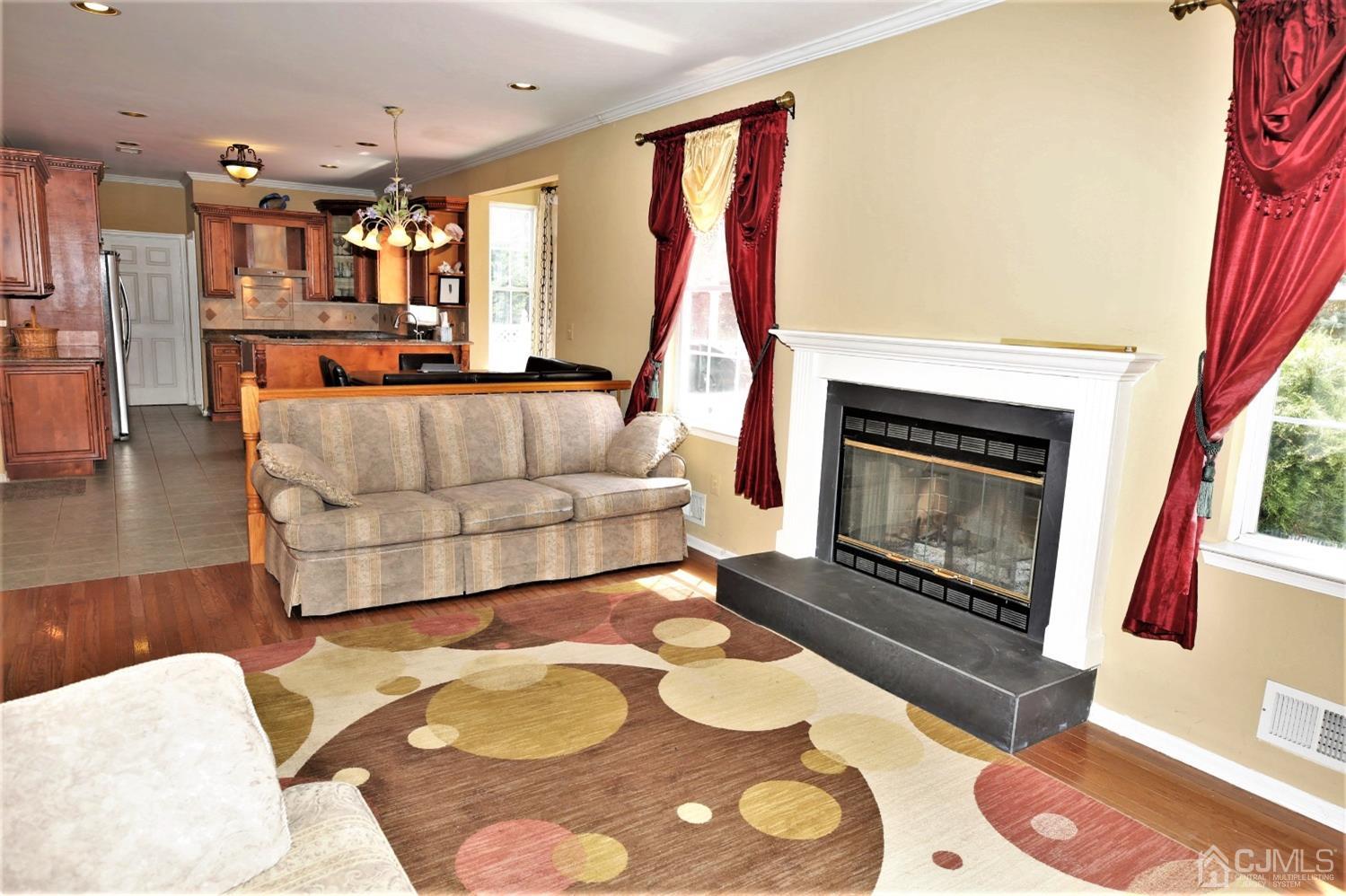 28 Lexington Road Monmouth Junction, NJ 08852 - Photo 24 of 55 a living room with furniture and a fireplace