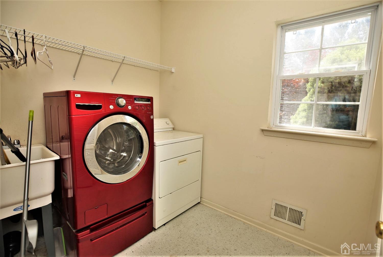 28 Lexington Road Monmouth Junction, NJ 08852 - Photo 26 of 55 a view of a storage & utility room with washer and dryer
