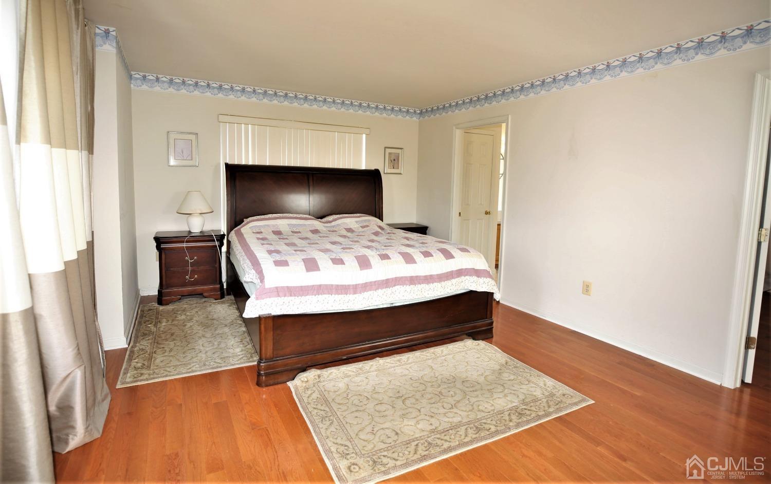 28 Lexington Road Monmouth Junction, NJ 08852 - Photo 29 of 55 a bed sitting in a bedroom next to a window