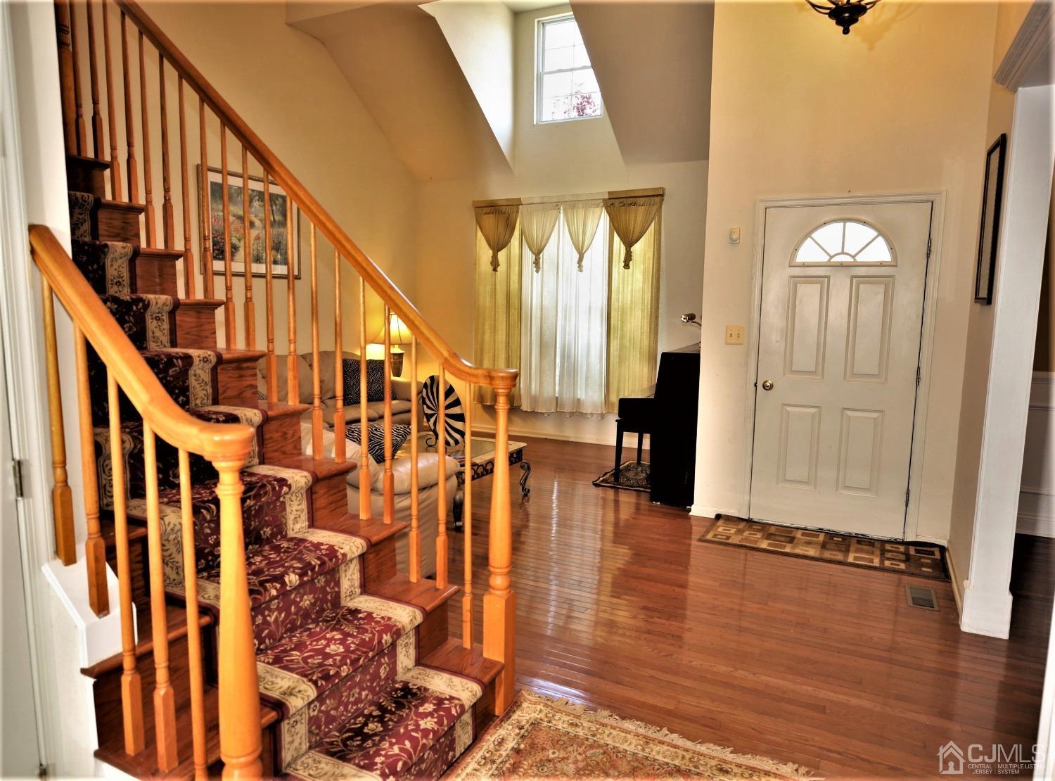 28 Lexington Road Monmouth Junction, NJ 08852 - Photo 3 of 55 a view of an entryway with wooden floor