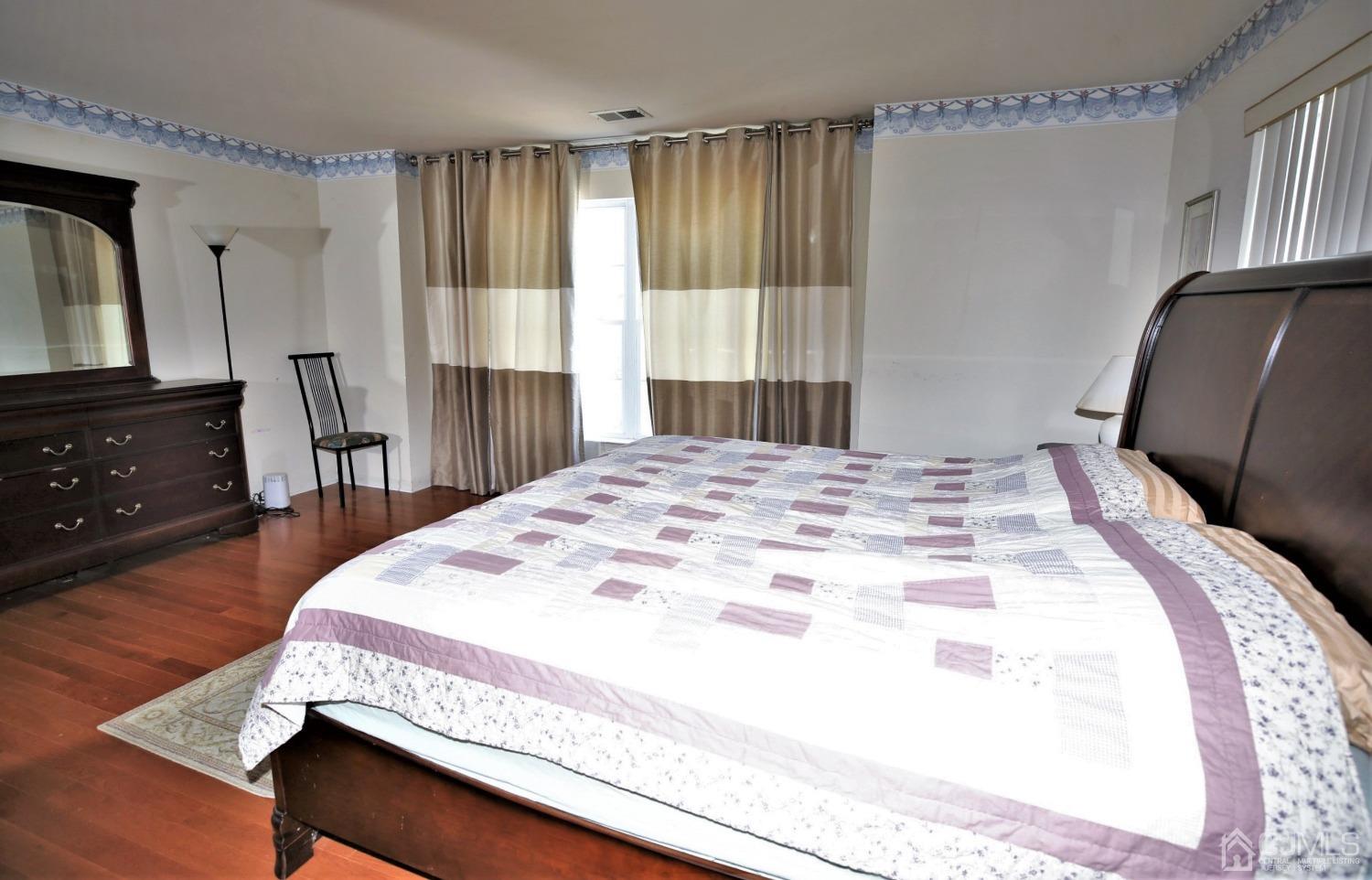28 Lexington Road Monmouth Junction, NJ 08852 - Photo 31 of 55 a bedroom with a bed and wooden floor