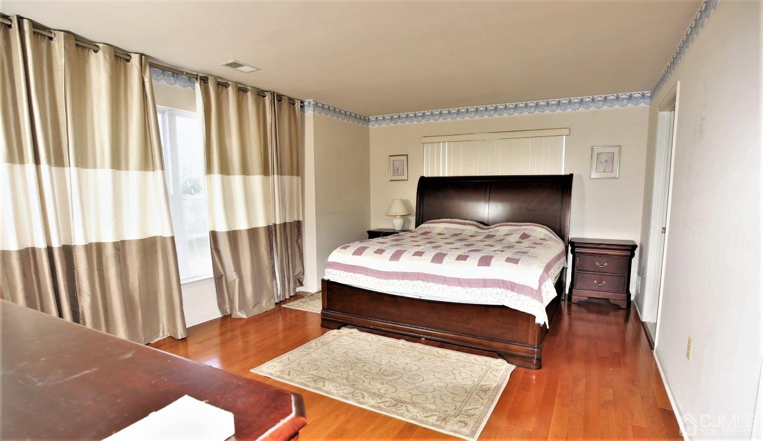 28 Lexington Road Monmouth Junction, NJ 08852 - Photo 32 of 55 a bedroom with a bed and a rug