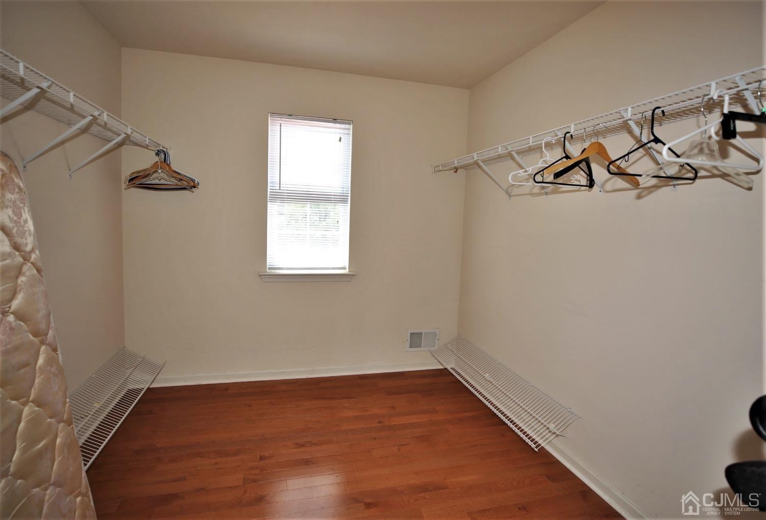 28 Lexington Road Monmouth Junction, NJ 08852 - Photo 35 of 55 a view of a room with rack on the wall and a window