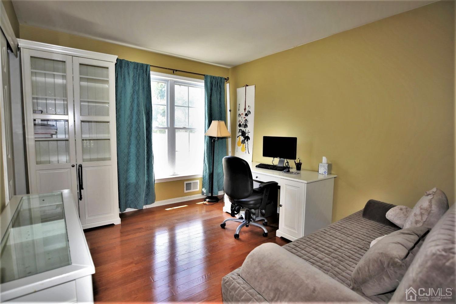 28 Lexington Road Monmouth Junction, NJ 08852 - Photo 40 of 55 a bedroom with furniture and a flat screen tv