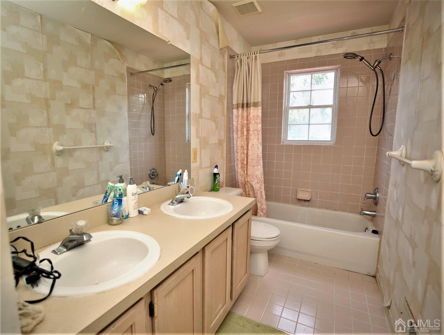 28 Lexington Road Monmouth Junction, NJ 08852 - Photo 42 of 55 a bathroom with a double vanity sink toilet and shower