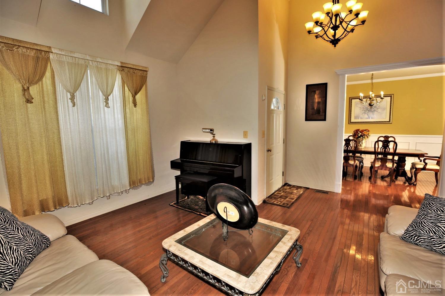 28 Lexington Road Monmouth Junction, NJ 08852 - Photo 5 of 55 a living room with furniture and wooden floor