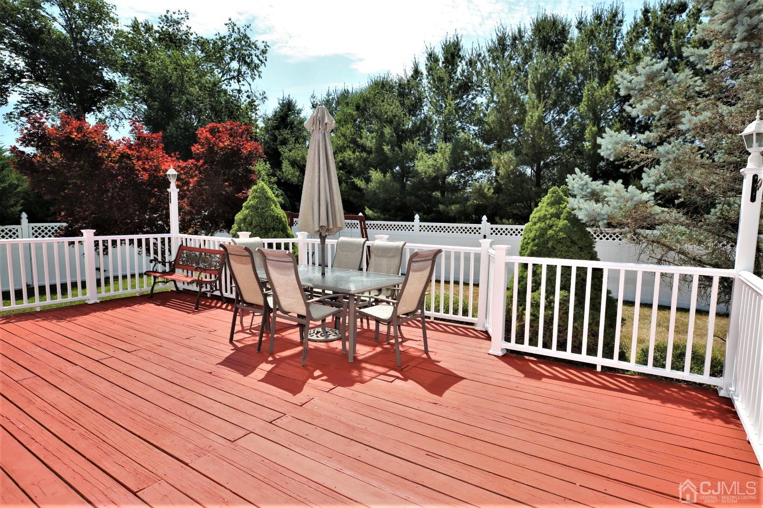 28 Lexington Road Monmouth Junction, NJ 08852 - Photo 53 of 55 a view of a wooden deck with furniture