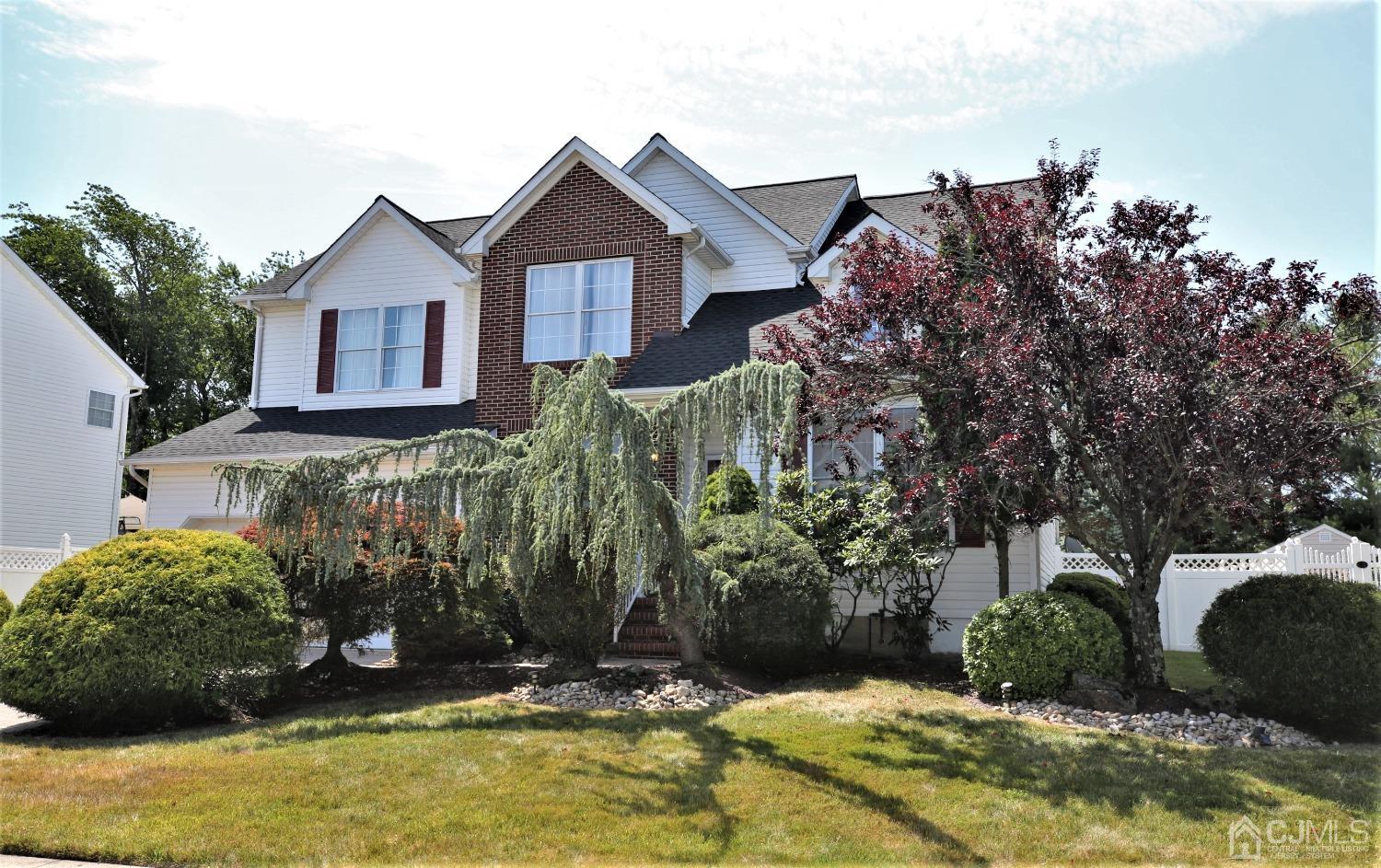 28 Lexington Road Monmouth Junction, NJ 08852 - Photo 55 of 55 a front view of a house with a yard