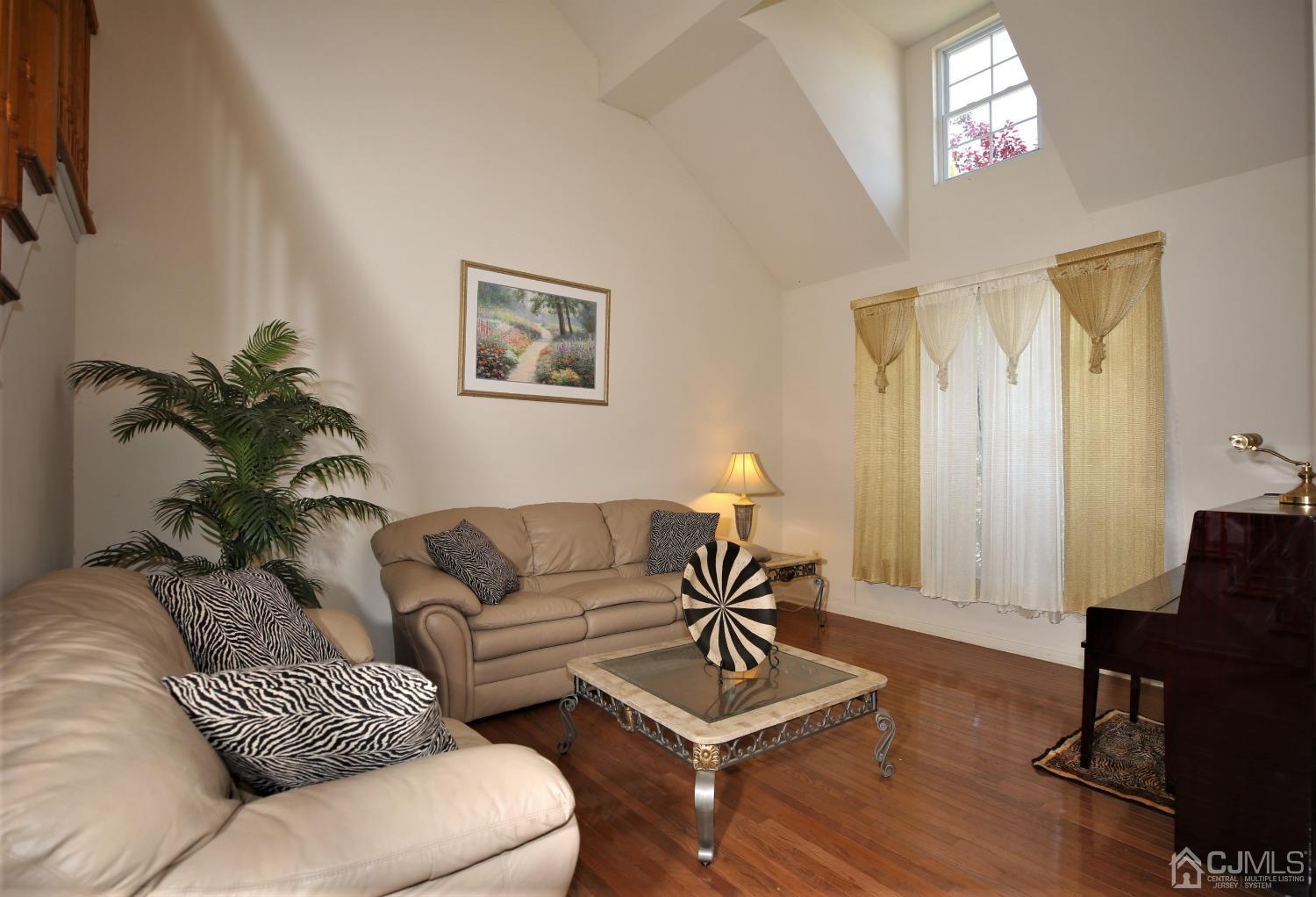28 Lexington Road Monmouth Junction, NJ 08852 - Photo 7 of 55 a living room with furniture and a potted plant