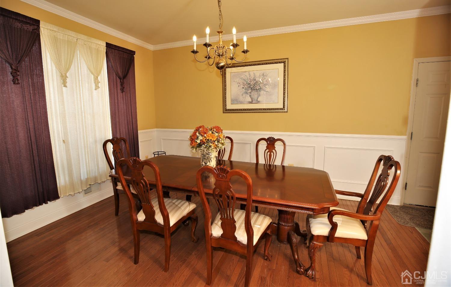 28 Lexington Road Monmouth Junction, NJ 08852 - Photo 8 of 55 a view of a dining room with furniture and chandelier
