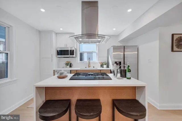 a kitchen with a table and chairs in it