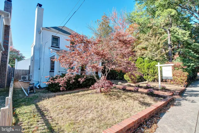 a view of a backyard with sitting area