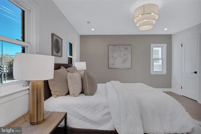 a bedroom with a bed and window