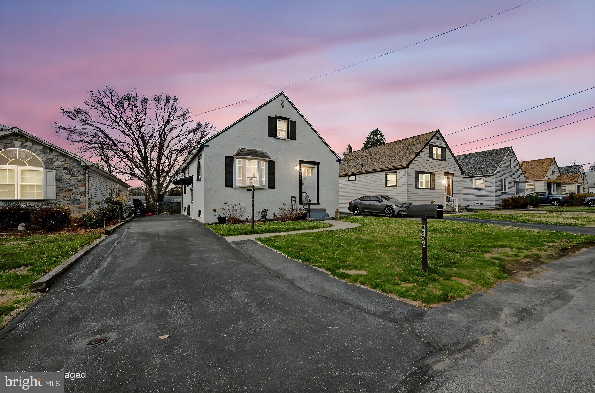 4906 Shepherd Street Brookhaven, PA 19015 - Photo 1 of 29 a front view of a house with a yard and garage