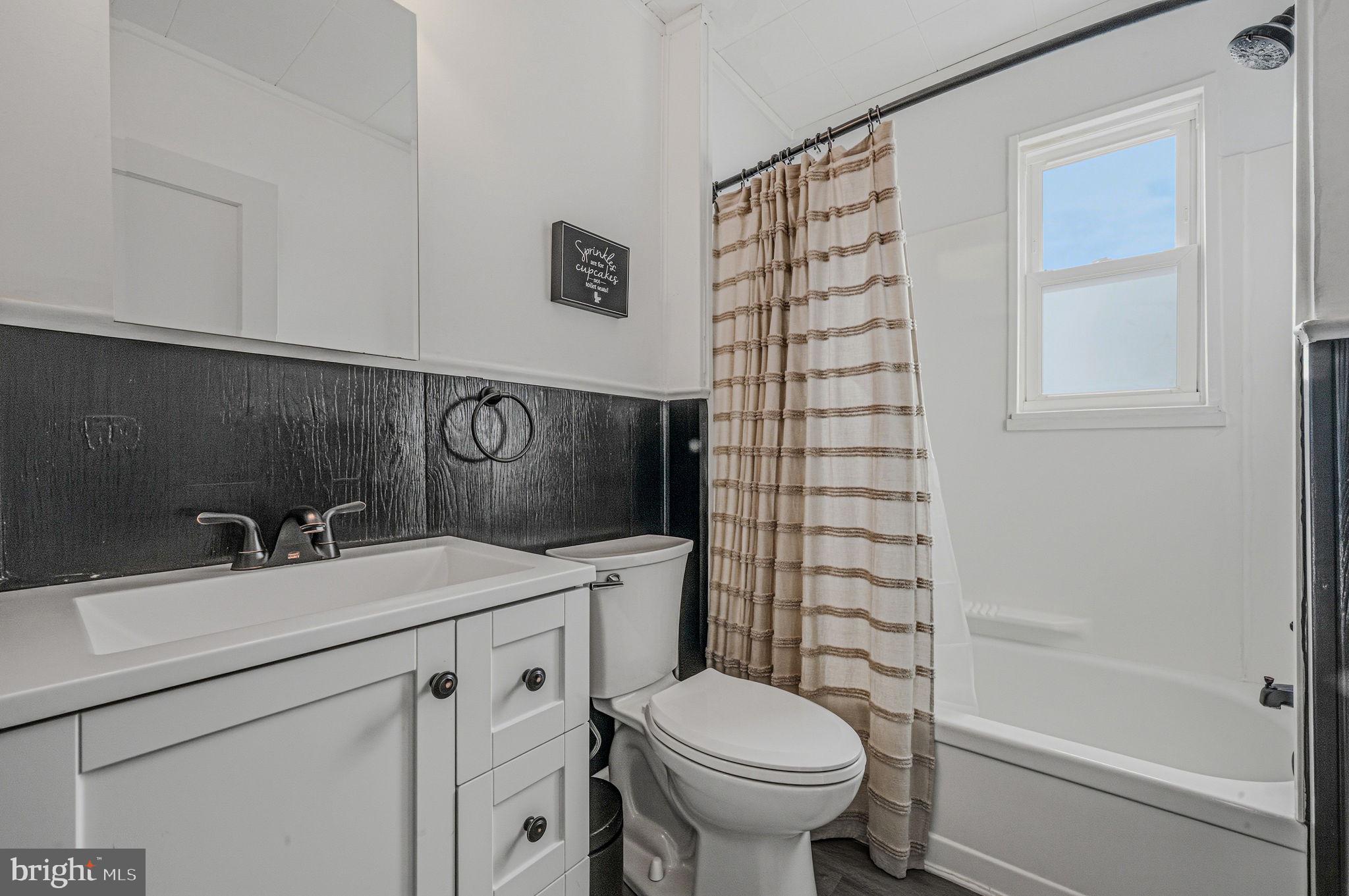 4906 Shepherd Street Brookhaven, PA 19015 - Photo 17 of 29 a bathroom with a sink toilet and shower