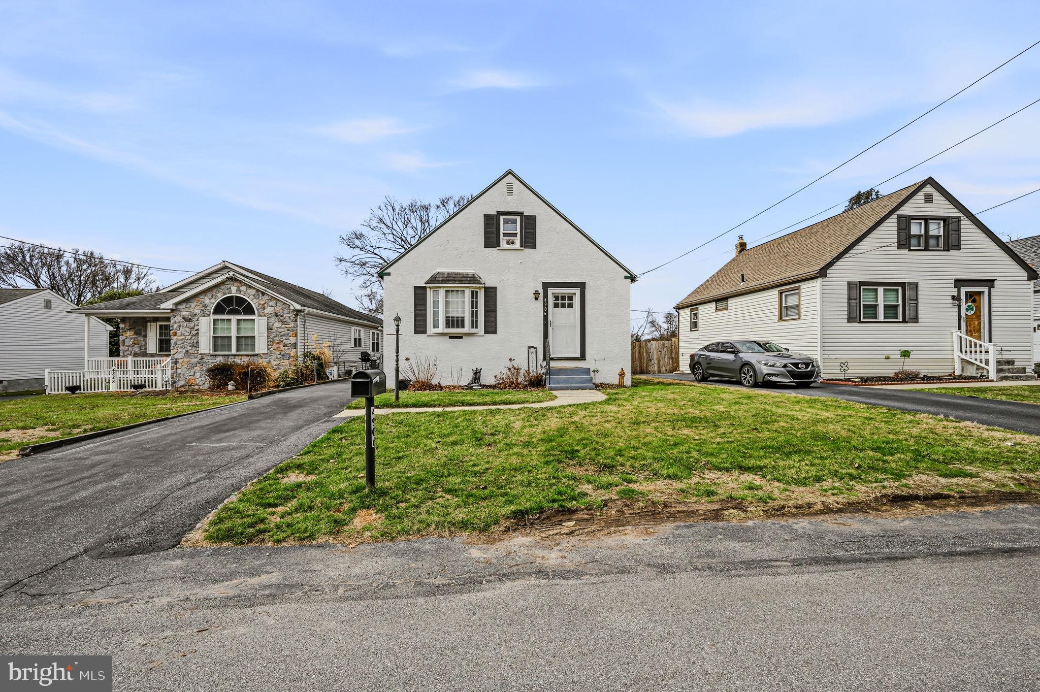 4906 Shepherd Street Brookhaven, PA 19015 - Photo 3 of 29 a front view of a house with a yard and garage