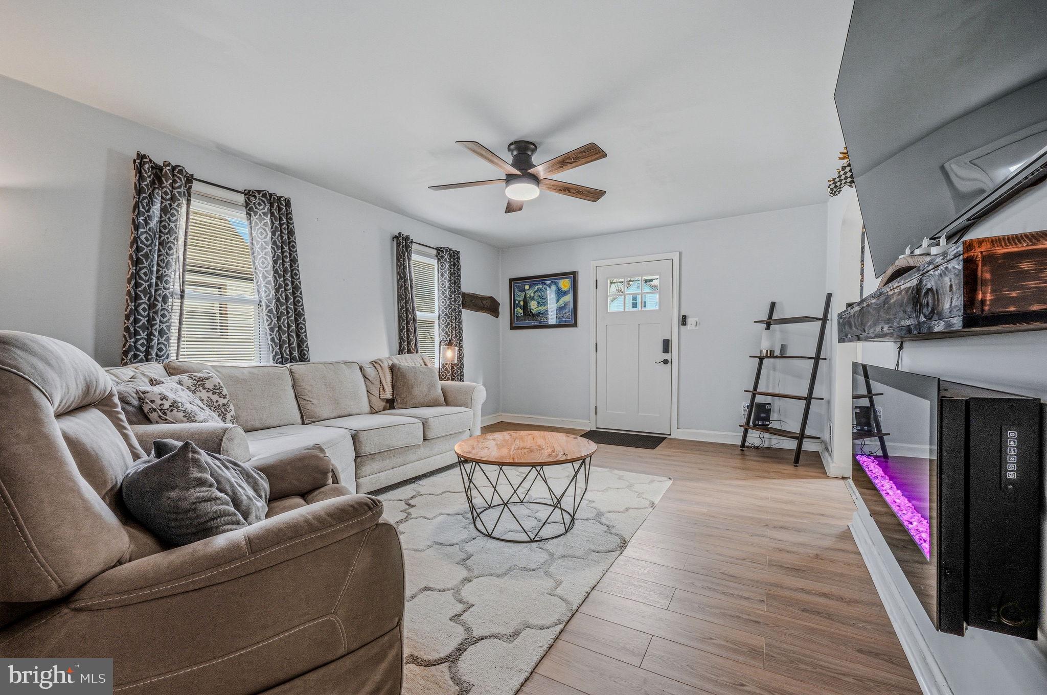 4906 Shepherd Street Brookhaven, PA 19015 - Photo 6 of 29 a living room with furniture and a fireplace