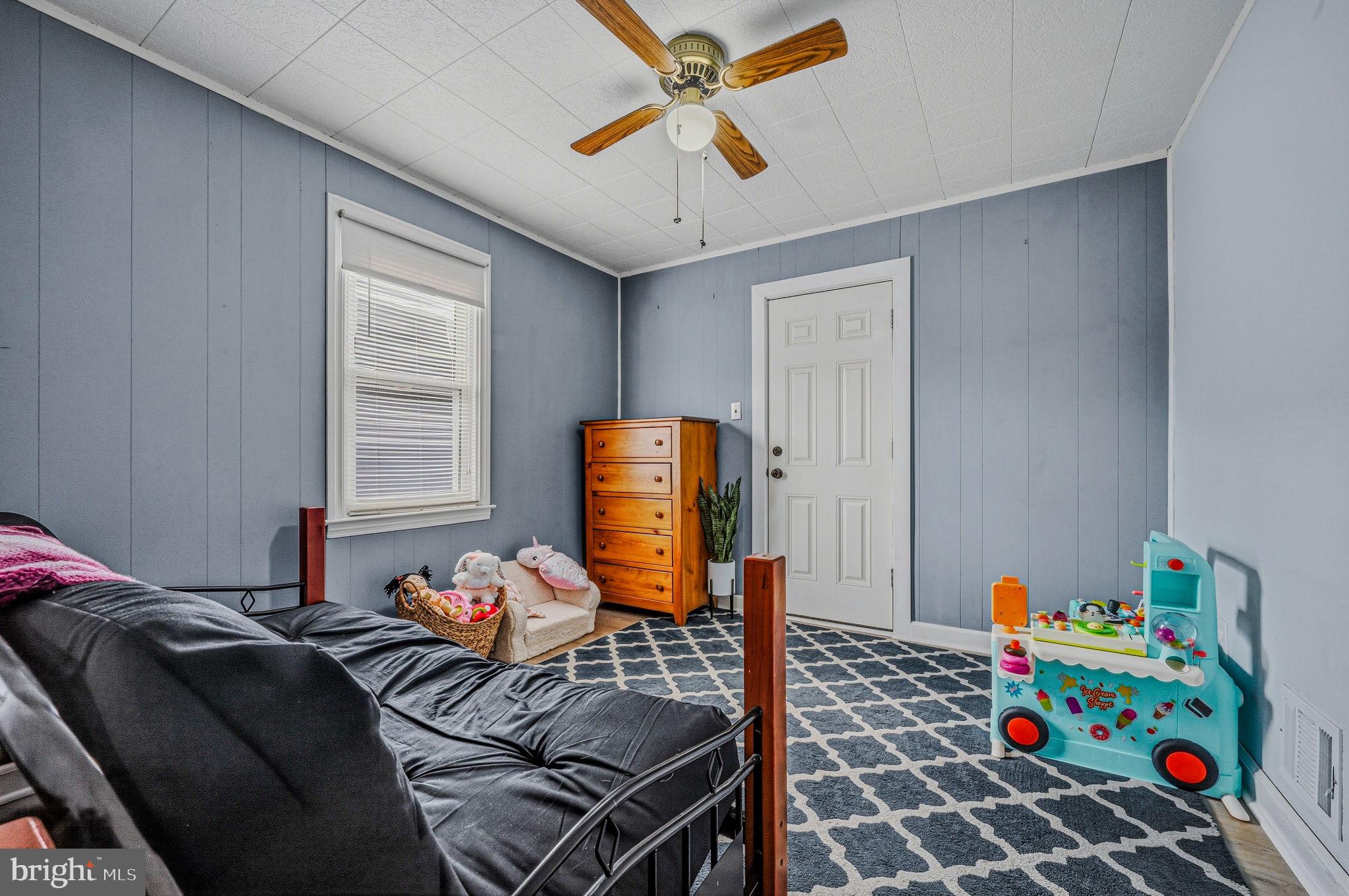 4906 Shepherd Street Brookhaven, PA 19015 - Photo 10 of 29 a bedroom with furniture and a window