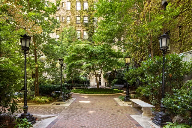 a view of hall with a large window and couch