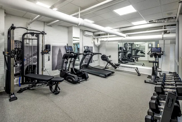 a view of a patio with couches table and chairs and potted plants