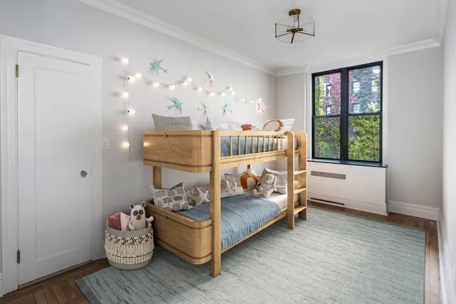 a bedroom with bed and a window