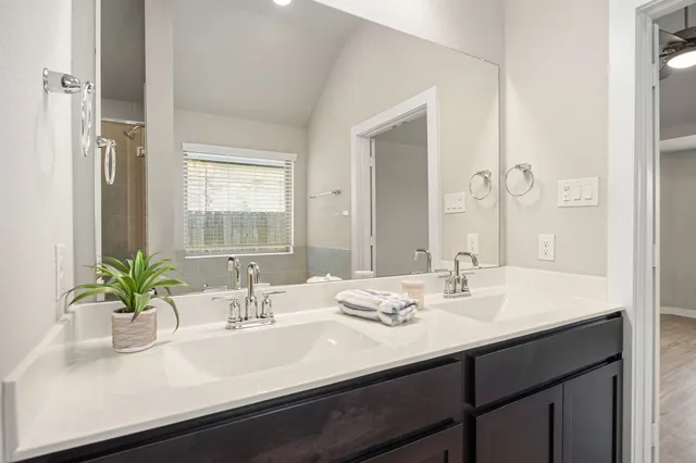 a bathroom with a sink a vanity and a mirror